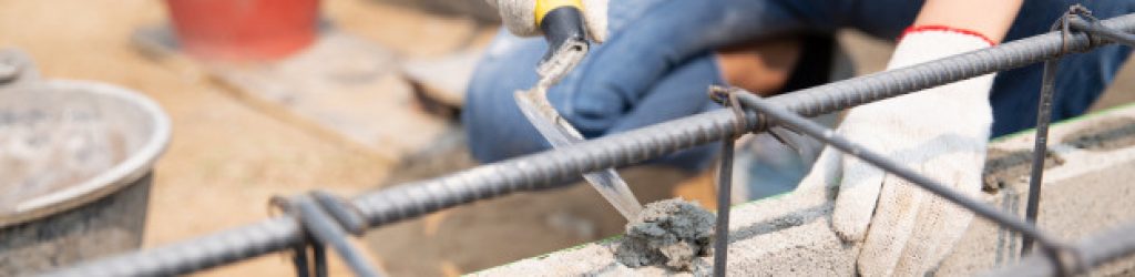 bricklayer-worker-installing-brick-masonry-exterior-wall-with-trowel-putty-knife_1150-10144